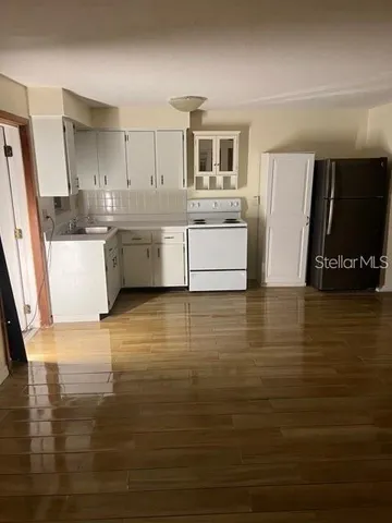 a kitchen with stainless steel appliances wooden cabinets and a counter top space