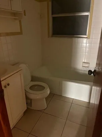 a bathroom with a toilet a sink and a bathtub