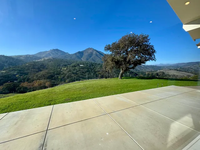 a view of a garden and basketball court