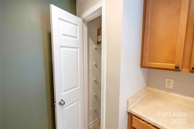 a bathroom with a granite countertop sink and vanity