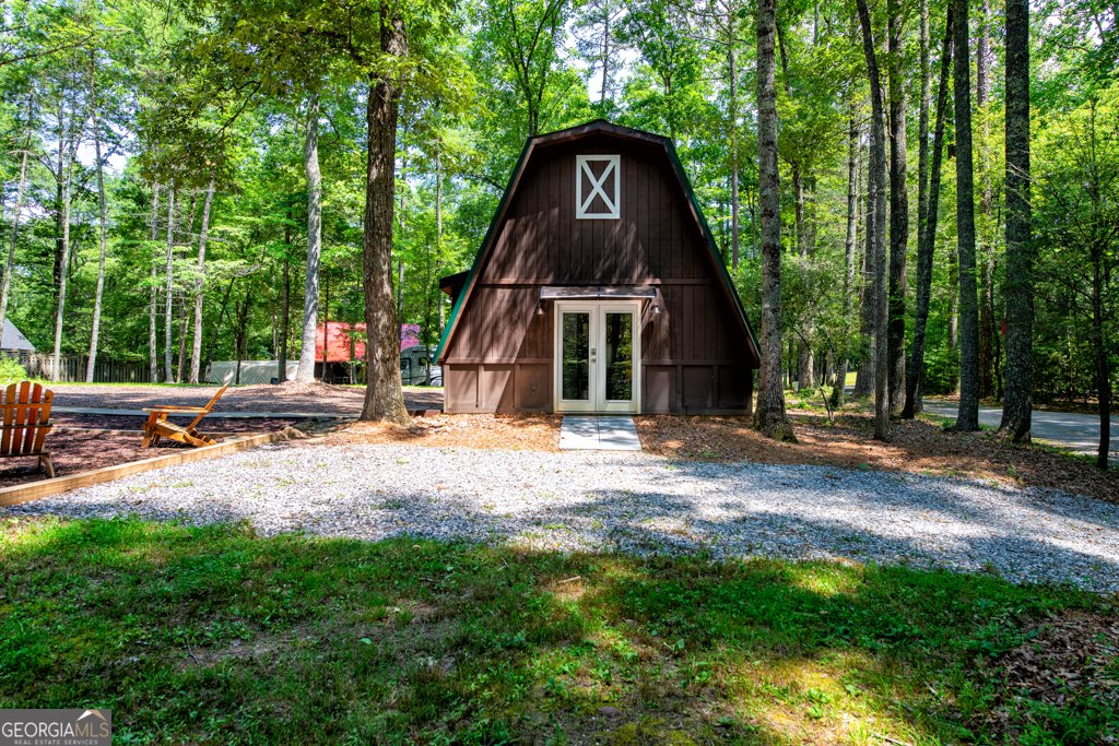 67 Big Tree Road Suches, GA 30572 - Photo 17 of 27 a view of a house with backyard and trees
