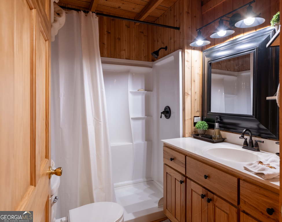 67 Big Tree Road Suches, GA 30572 - Photo 9 of 27 a bathroom with a granite countertop sink toilet and shower