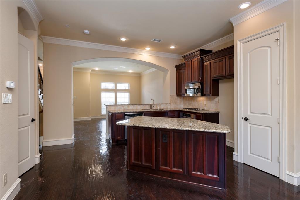 7914 Bishop Road Plano, TX 75024 - Photo 13 of 33 a kitchen with a sink stove and cabinets