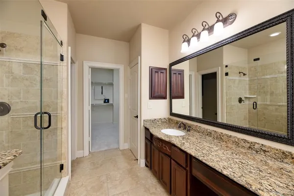 a walk in closet with view of walk in closet