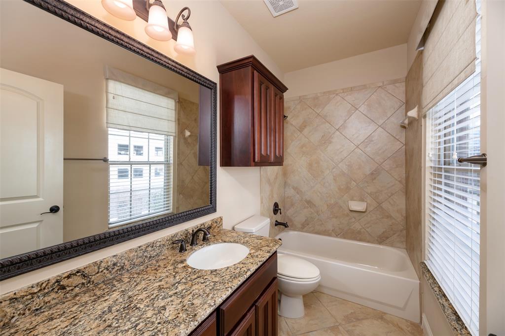 7914 Bishop Road Plano, TX 75024 - Photo 24 of 33 a bathroom with a granite countertop sink toilet and shower