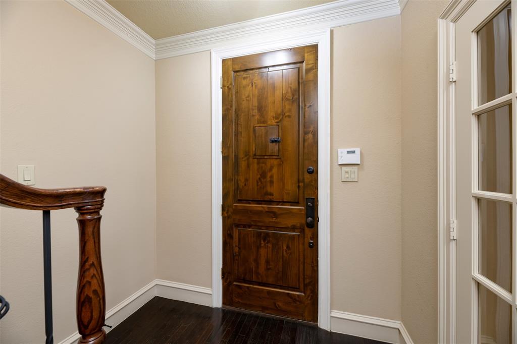 7914 Bishop Road Plano, TX 75024 - Photo 3 of 33 a view of a hallway with wooden floor