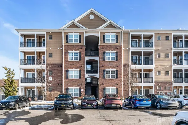 a front view of a building with lot of windows