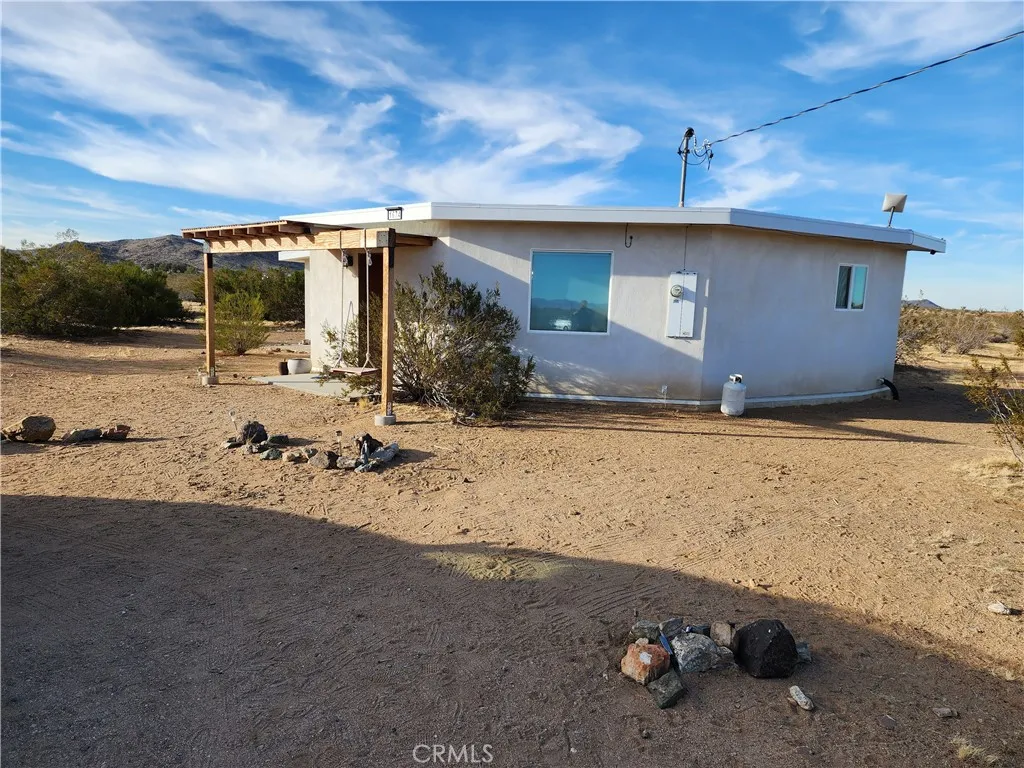 0 Patrick Joshua Tree, CA 92252 - Photo 4 of 15 a view of a backyard of a house
