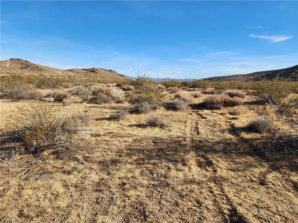 0 Patrick Joshua Tree, CA 92252 - Photo 6 of 15 a view of a large mountain with mountains in the background