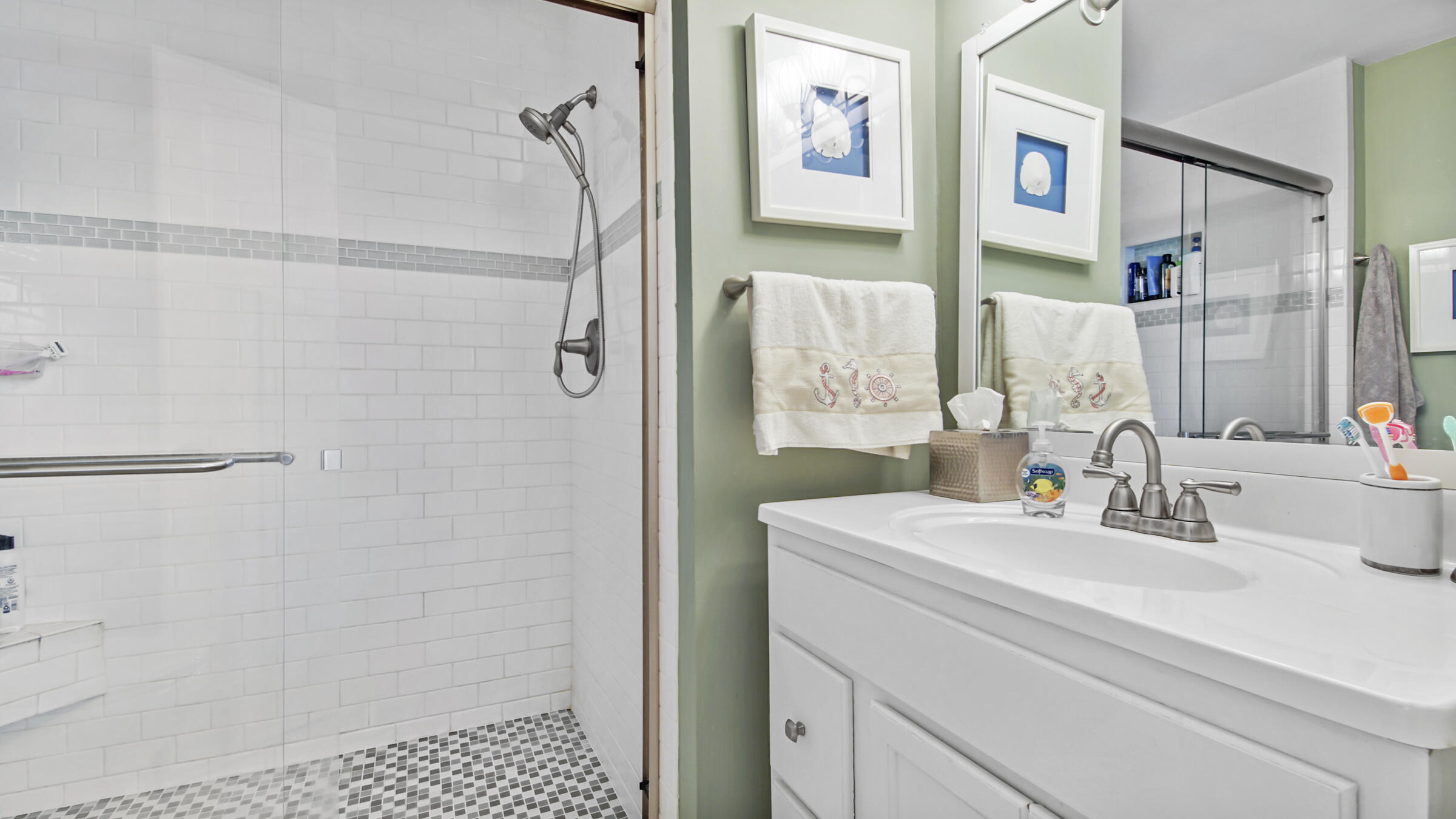 11 Driftwood Road, Unit 22 Miramar Beach, FL 32550 - Photo 16 of 29 a bathroom with a sink and a mirror