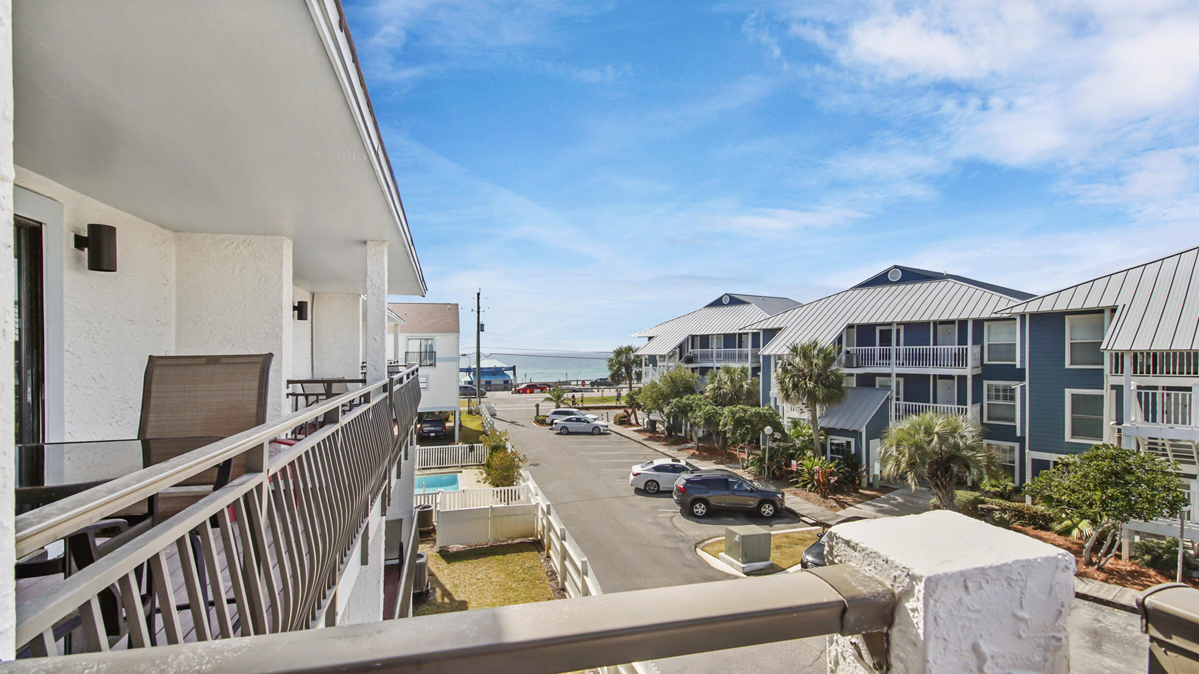 11 Driftwood Road, Unit 22 Miramar Beach, FL 32550 - Photo 18 of 29 a view of a house with wooden deck and furniture