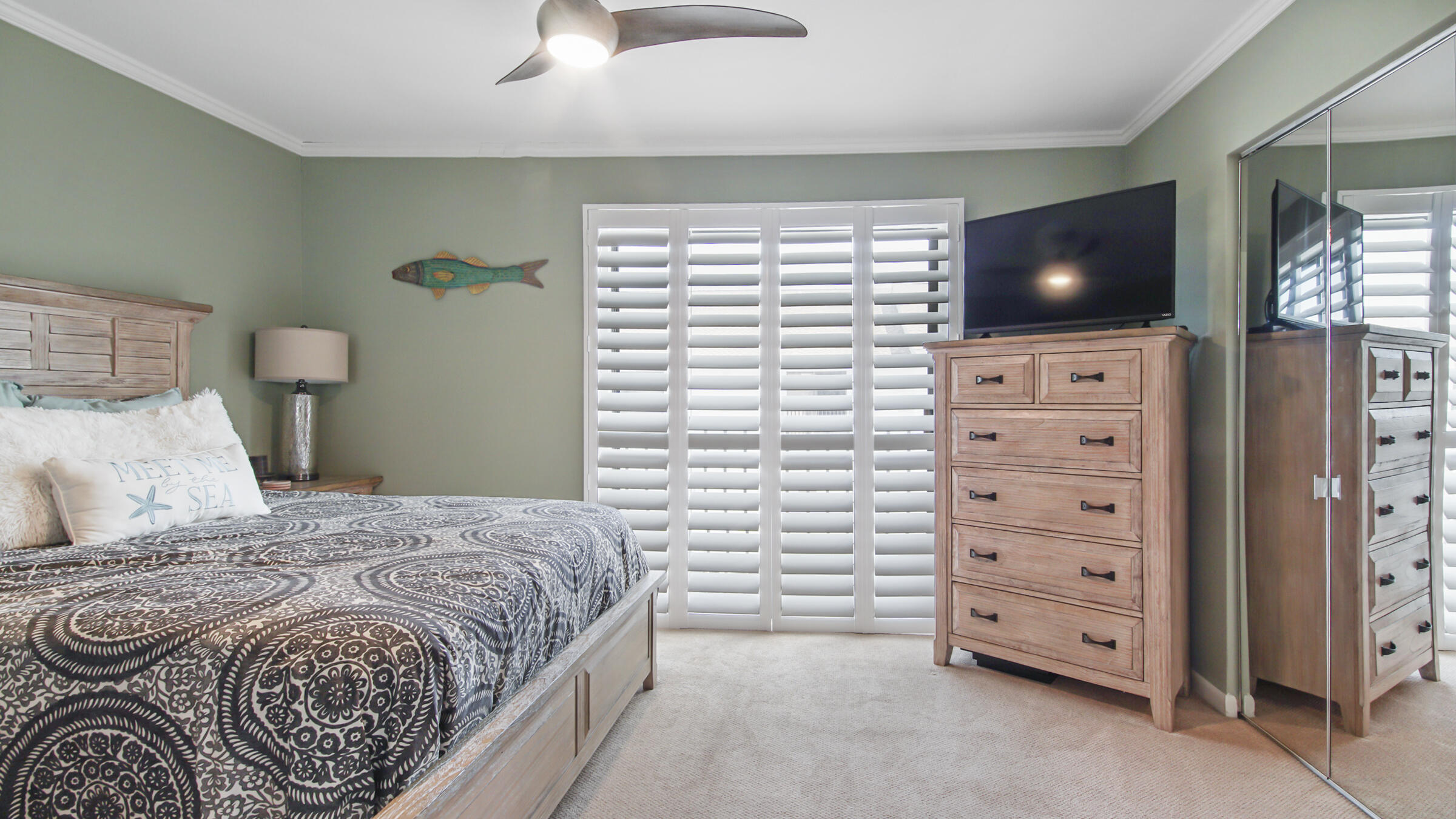 11 Driftwood Road, Unit 22 Miramar Beach, FL 32550 - Photo 19 of 29 a bedroom with a bed and a flat screen tv