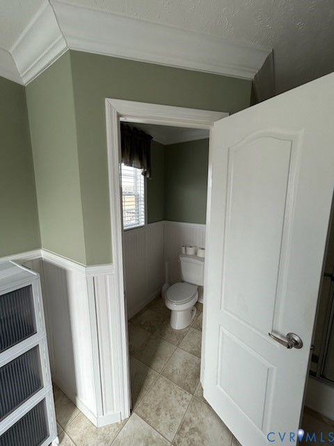 15910 Nobles Road Disputanta, VA 23842 - Photo 30 of 38 Bathroom with wainscoting and light tile patterned