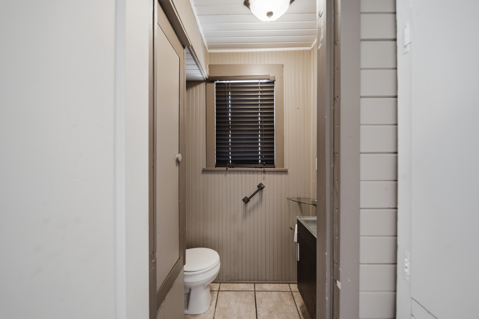304 West Chamberlin Street Dixon, IL 61021 - Photo 18 of 28 a bathroom with a granite countertop toilet and a sink