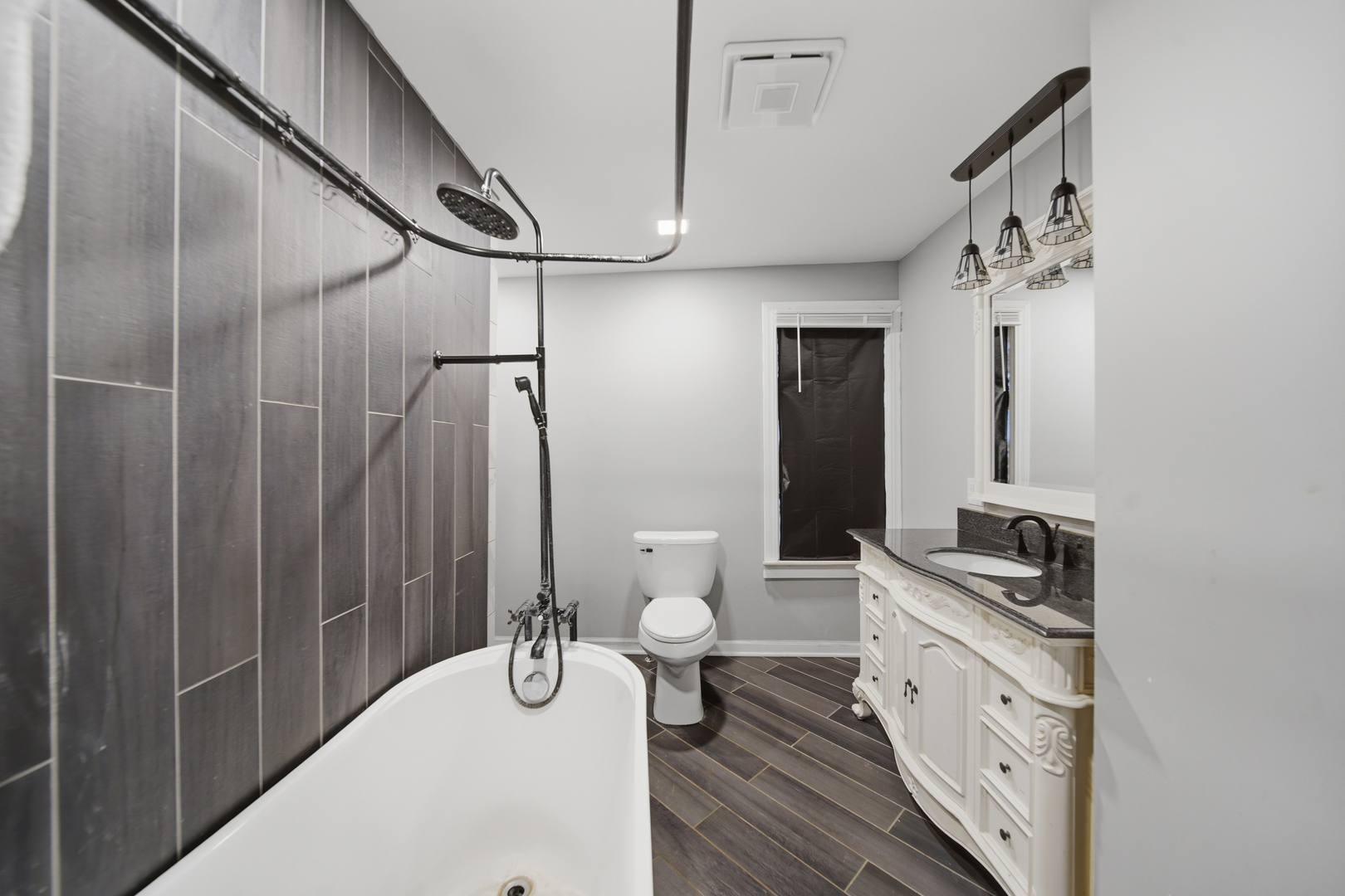 304 West Chamberlin Street Dixon, IL 61021 - Photo 20 of 28 a bathroom with a granite countertop sink a toilet and shower