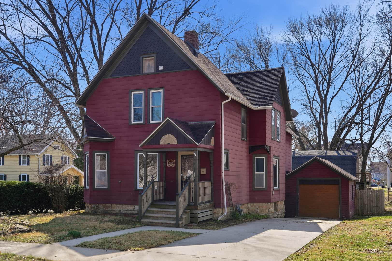 304 West Chamberlin Street Dixon, IL 61021 - Photo 2 of 28 a front view of a house with garden