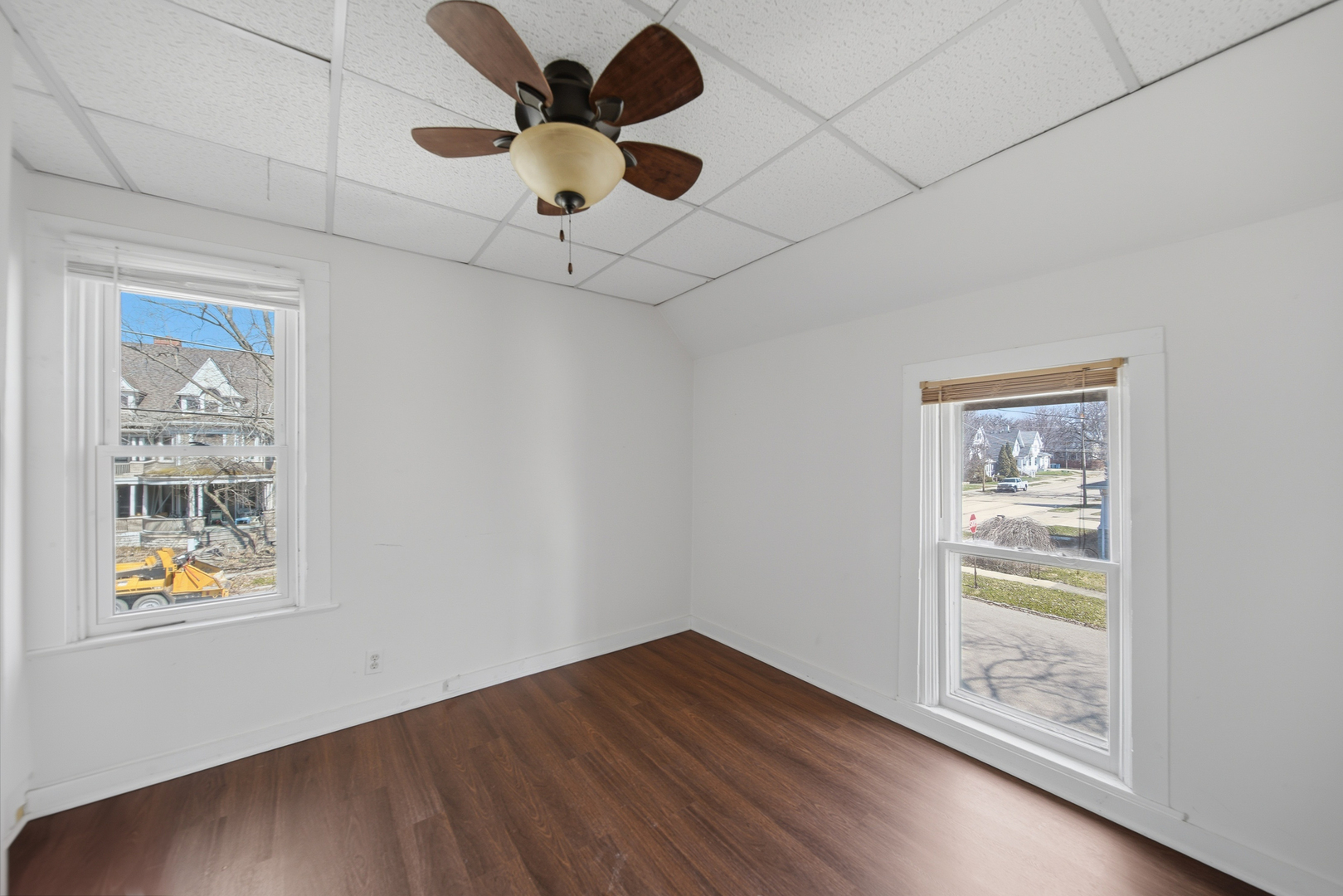 304 West Chamberlin Street Dixon, IL 61021 - Photo 24 of 28 a view of an empty room with a window and wooden floor