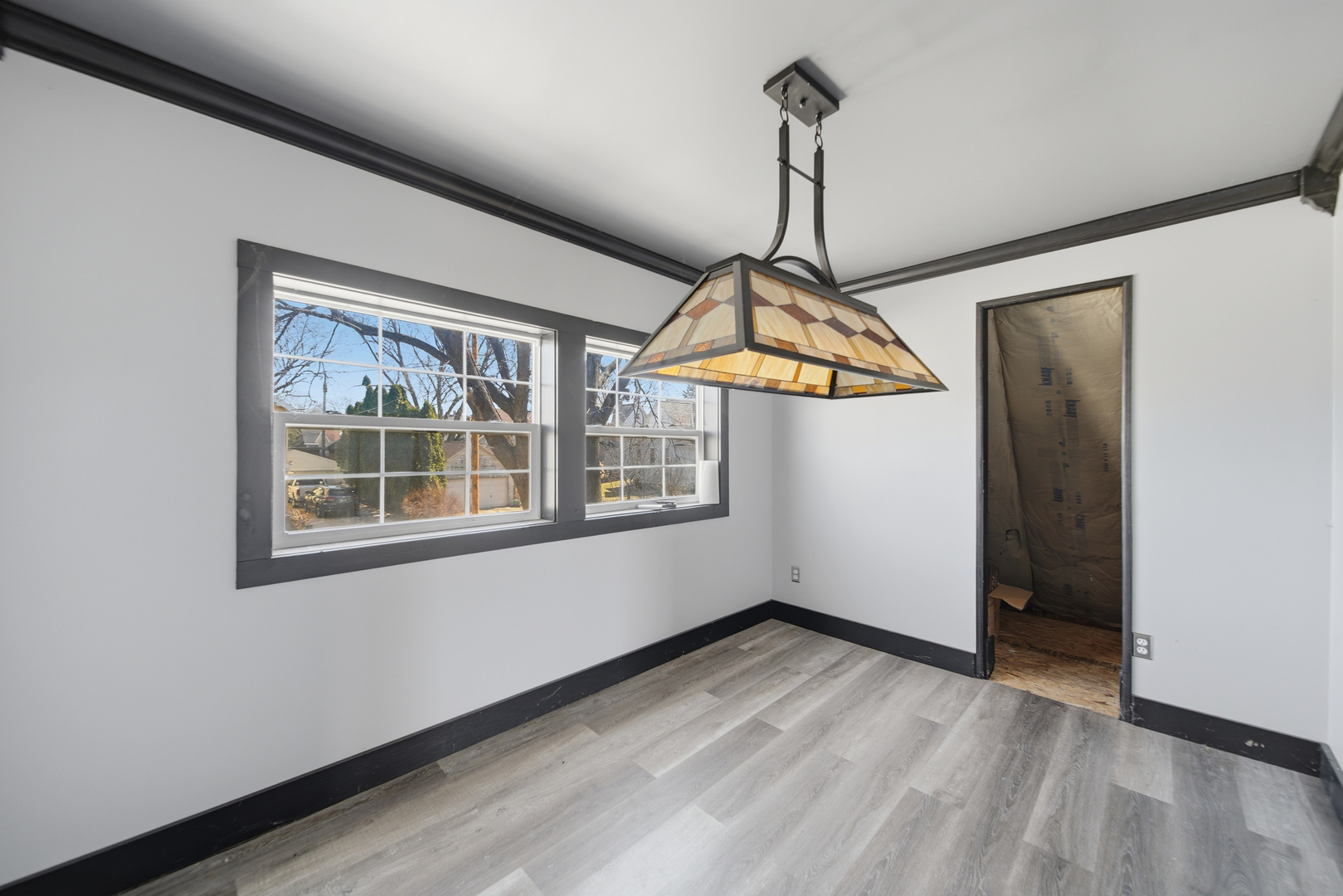 304 West Chamberlin Street Dixon, IL 61021 - Photo 27 of 28 a view of a room with a ceiling fan and window