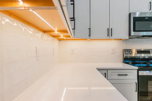 a bathroom with a sink and a microwave