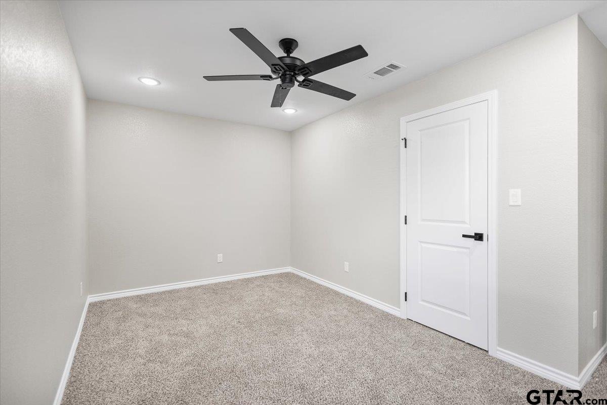 1607 North Ross Avenue Tyler, TX 75702 - Photo 18 of 39 a view of a hallway with a ceiling fan