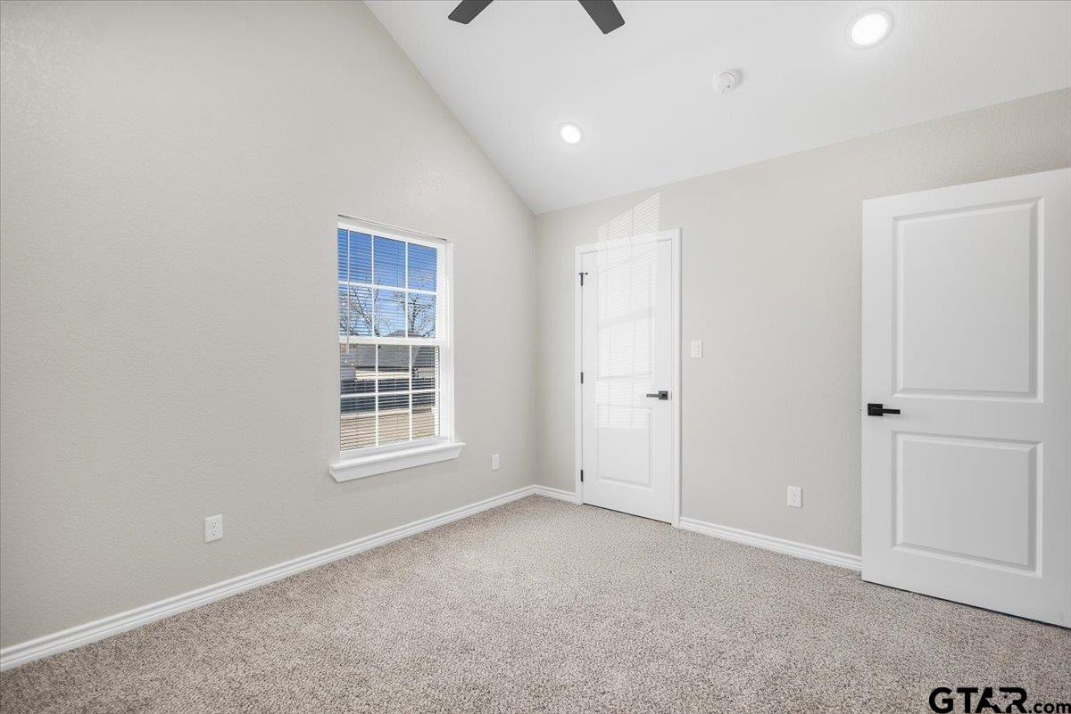 1607 North Ross Avenue Tyler, TX 75702 - Photo 21 of 39 a view of an empty room with a window