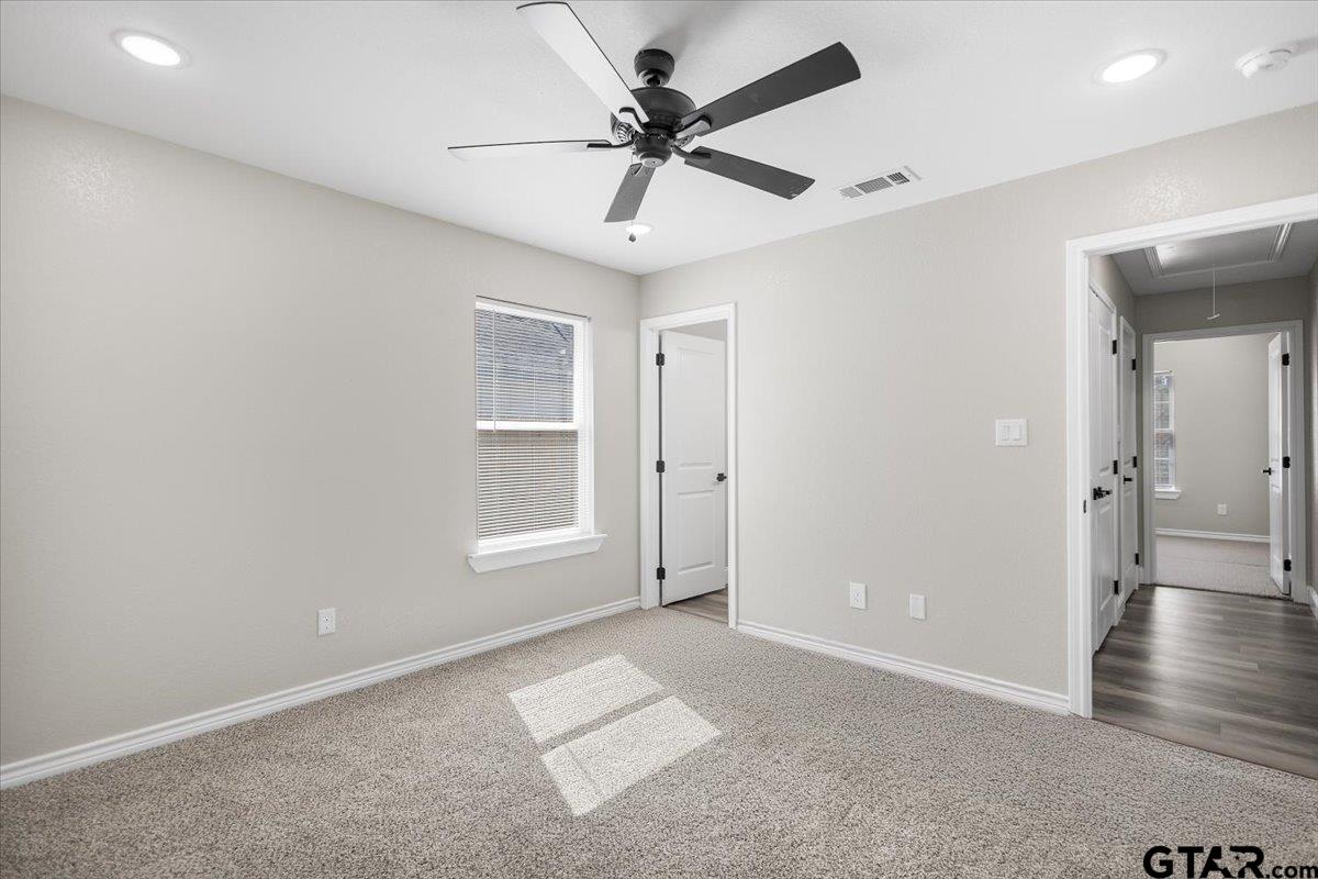 1607 North Ross Avenue Tyler, TX 75702 - Photo 26 of 39 wooden floor in an empty room with a window