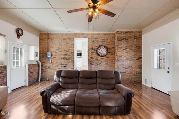 a living room with furniture and a clock