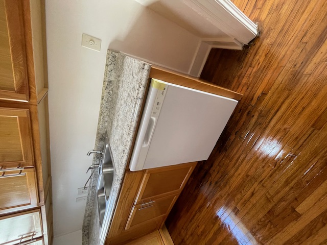 2104 Enfield Road, Unit B Austin, TX 78703 - Photo 5 of 15 a kitchen with granite countertop a sink and cabinets