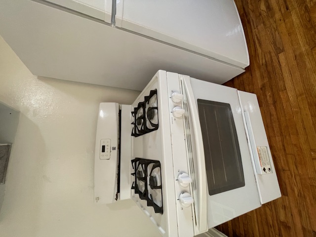 2104 Enfield Road, Unit B Austin, TX 78703 - Photo 6 of 15 a stove top oven sitting inside of a kitchen