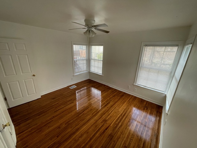 2104 Enfield Road, Unit B Austin, TX 78703 - Photo 10 of 15 wooden floor in an empty room with a window