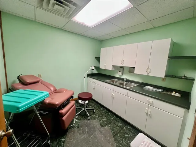 a kitchen with a sink and a stove top oven
