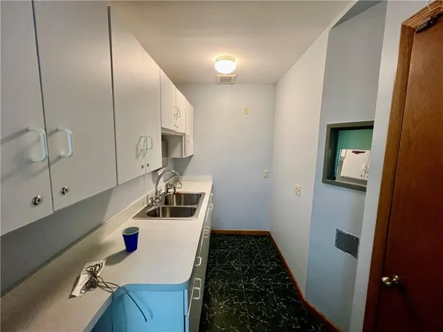 a bathroom with a sink and mirror