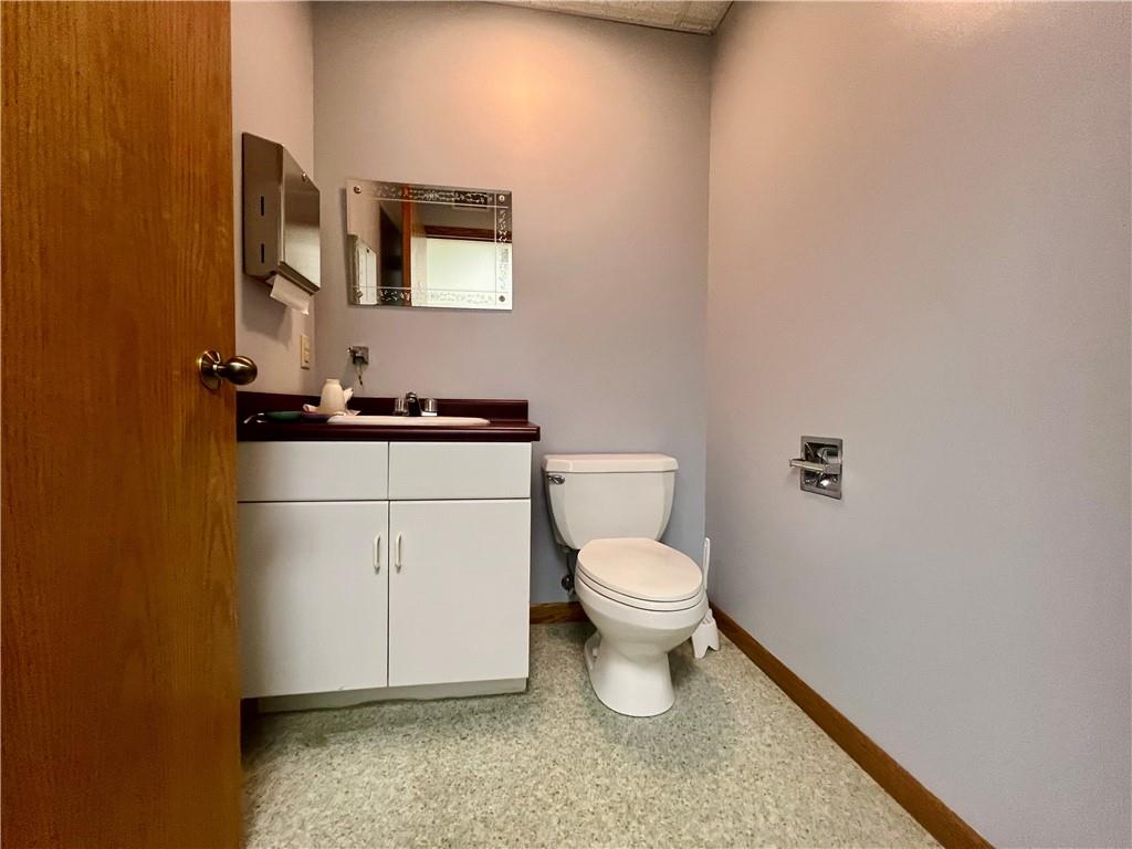 3121 Wilmington Road, Unit 3 New Castle, PA 16105 - Photo 18 of 21 a white toilet sitting next to a bathroom sink