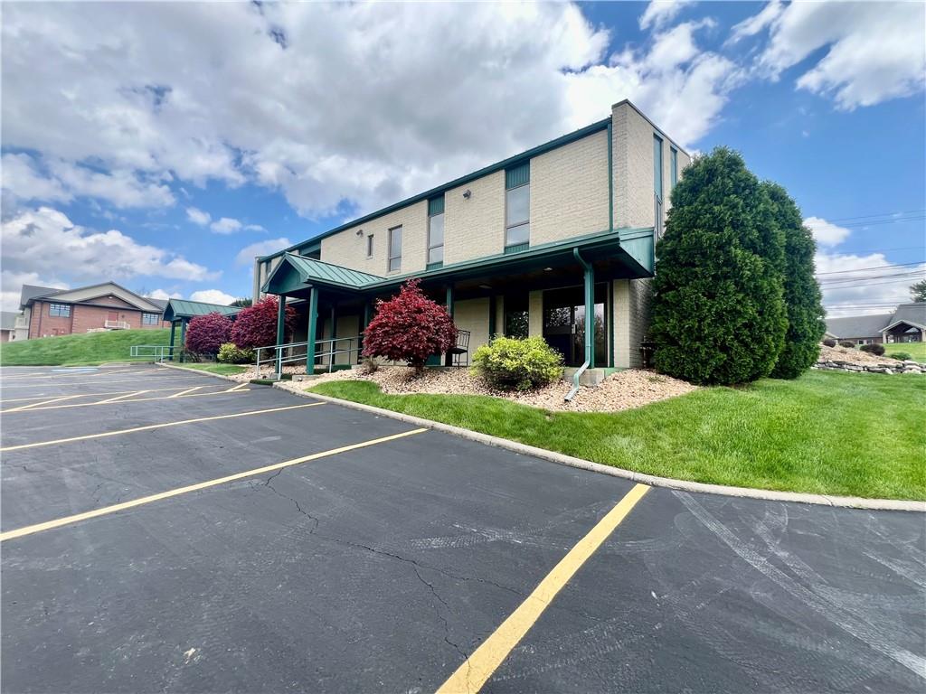 3121 Wilmington Road, Unit 3 New Castle, PA 16105 - Photo 3 of 21 a view of a house with a yard and plants