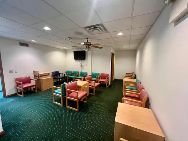 a living room with lots of furniture and a flat screen tv