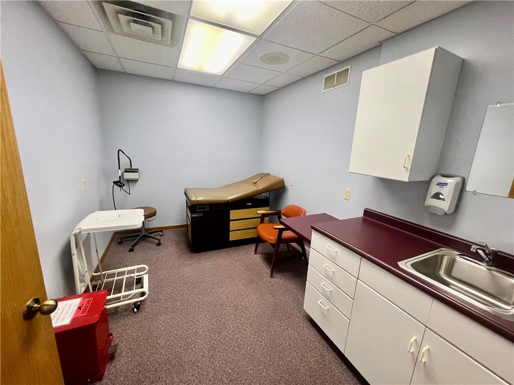 3121 Wilmington Road, Unit 3 New Castle, PA 16105 - Photo 8 of 21 a room with furniture and a chandelier