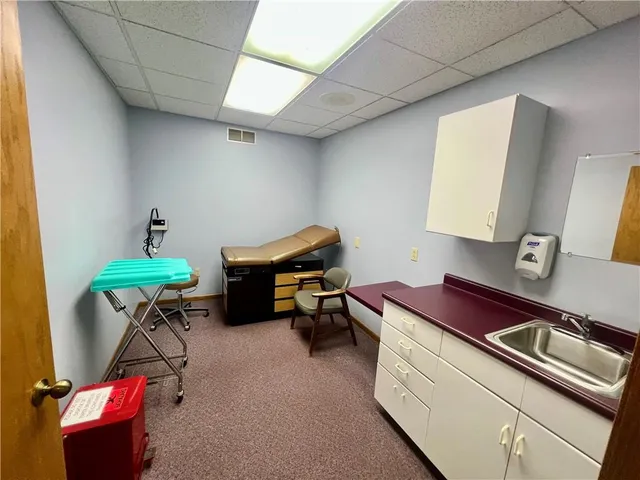 a reading room with furniture and a lamp on table