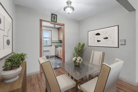 a view of a dining room with furniture and wooden floor