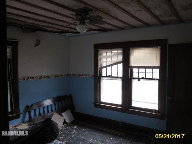 415 Bowen Street Savanna, IL 61074 - Photo 13 of 19 a view of a livingroom with furniture and window