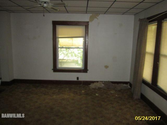 415 Bowen Street Savanna, IL 61074 - Photo 15 of 19 a view of an empty room with a window