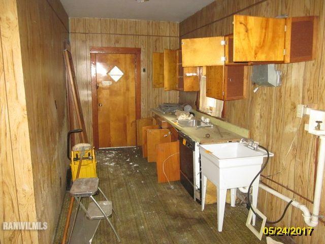 415 Bowen Street Savanna, IL 61074 - Photo 18 of 19 a bathroom with a granite countertop sink and a mirror