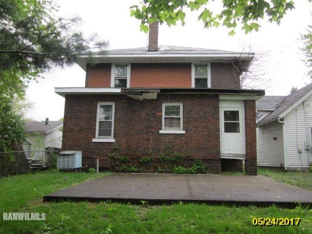 415 Bowen Street Savanna, IL 61074 - Photo 2 of 19 a front view of a house with a garden