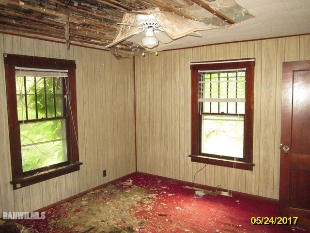 415 Bowen Street Savanna, IL 61074 - Photo 3 of 19 a view of an empty room with a window