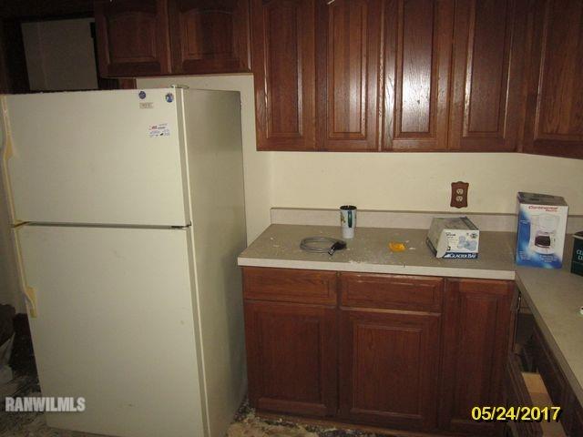 415 Bowen Street Savanna, IL 61074 - Photo 10 of 19 a white refrigerator freezer sitting inside of a kitchen