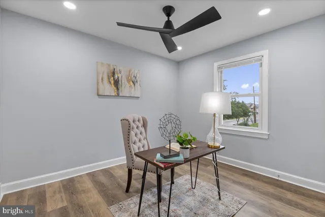 a room with furniture and a potted plant