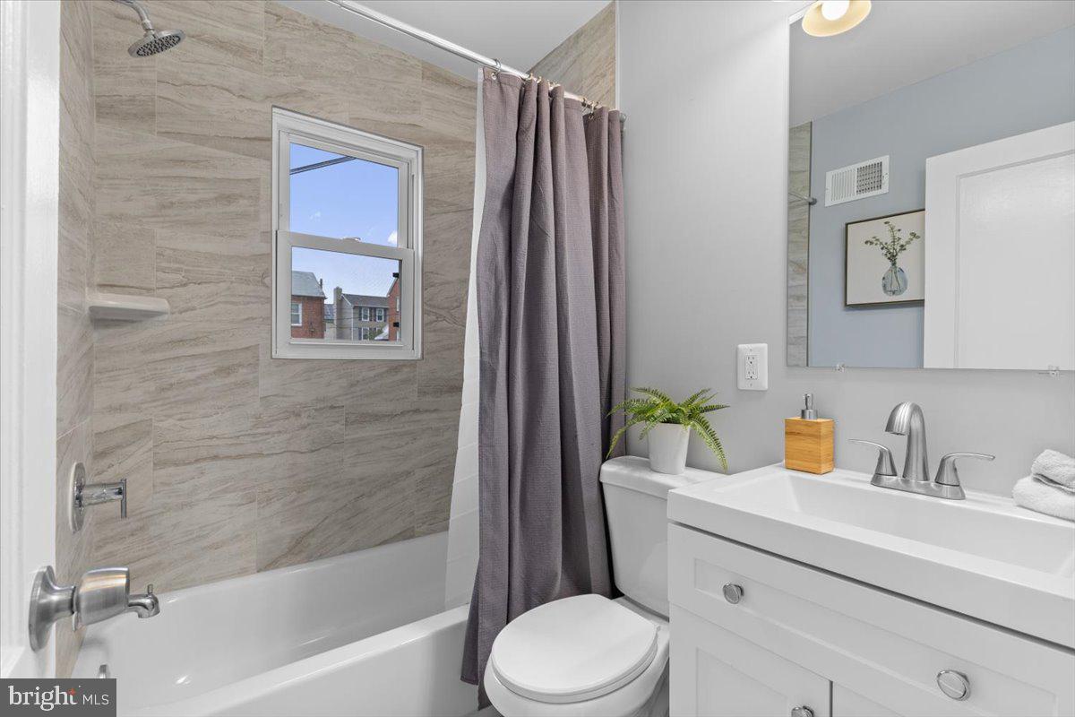 2202 U Place Southeast Washington, DC 20020 - Photo 13 of 21 a bathroom with a sink toilet and shower