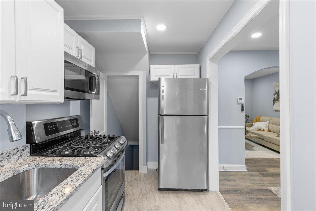 2202 U Place Southeast Washington, DC 20020 - Photo 10 of 21 a kitchen with a refrigerator stove and microwave