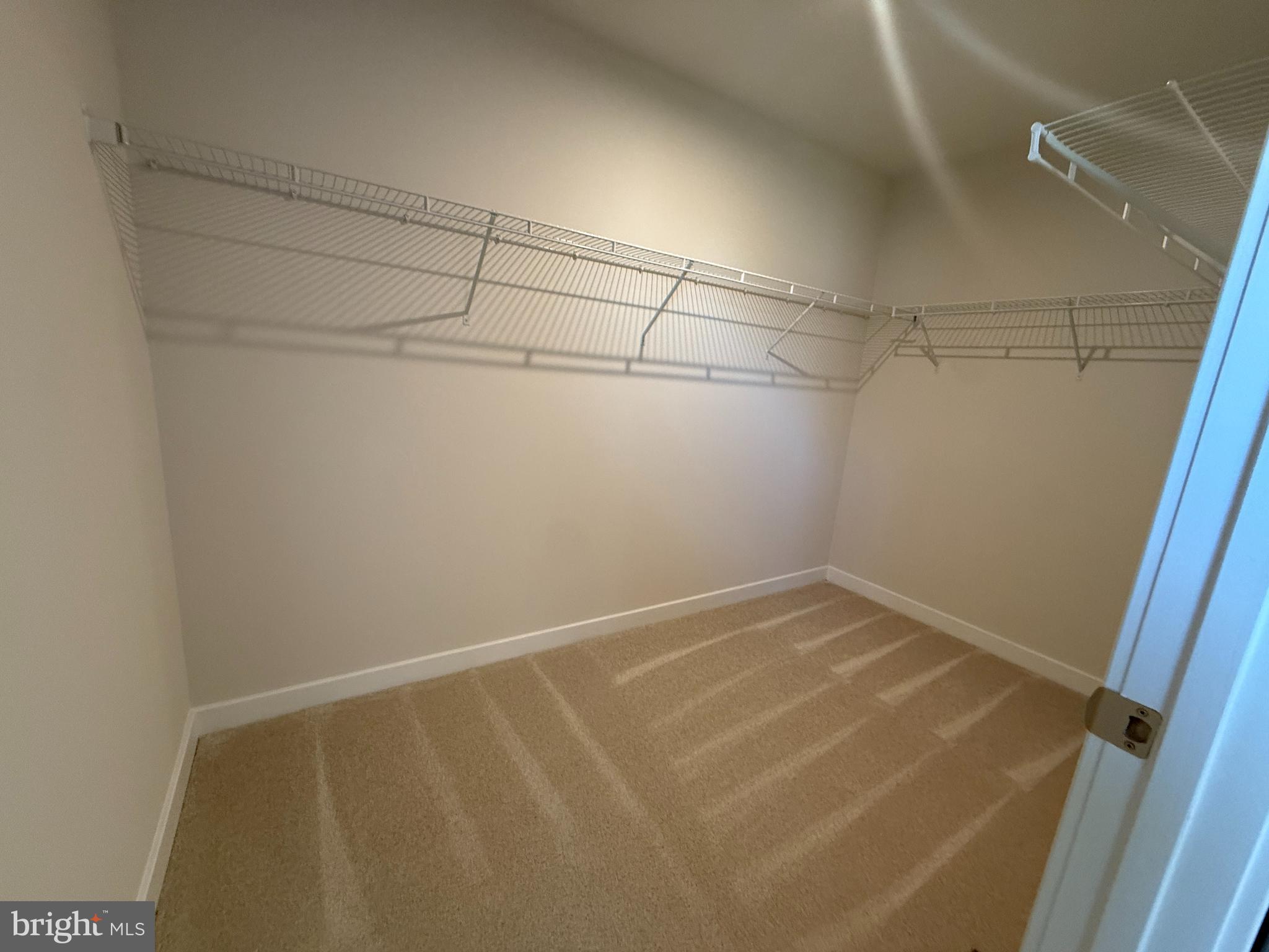 2506 Crown Point Circle Frederick, MD 21702 - Photo 14 of 21 a view of a room with racks on the wall