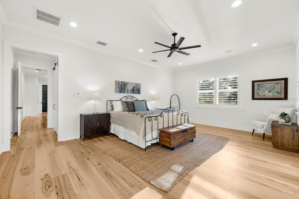 1044 Riverside Ridge Road Tarpon Springs, FL 34688 - Photo 33 of 77 a living room with furniture and a wooden floor