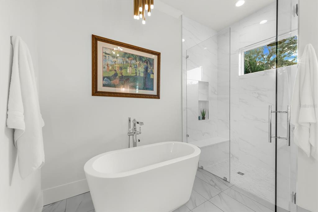 1044 Riverside Ridge Road Tarpon Springs, FL 34688 - Photo 36 of 77 a white bath tub sitting next to a white wall